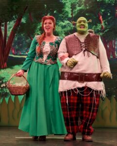 Emmie Wright as Princess Fiona and Joseph Betts as Shrek in CSODS's production of Shrek The Musical. - Credit: Chris Wright